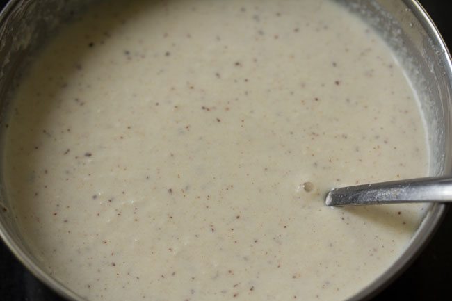 preparing batter by mixing with a spoon