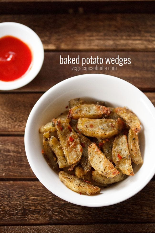 baked potato wedges in a white plate with ketchup
