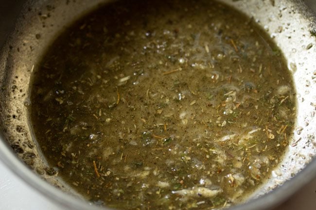 black pepper powder, oregano, basil, thyme, garlic, salt, rice flour and oil in a bowl mixed 