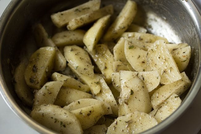 potatoes mixed with seasoning ingredients