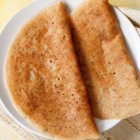 bread dosa served on a white plate.