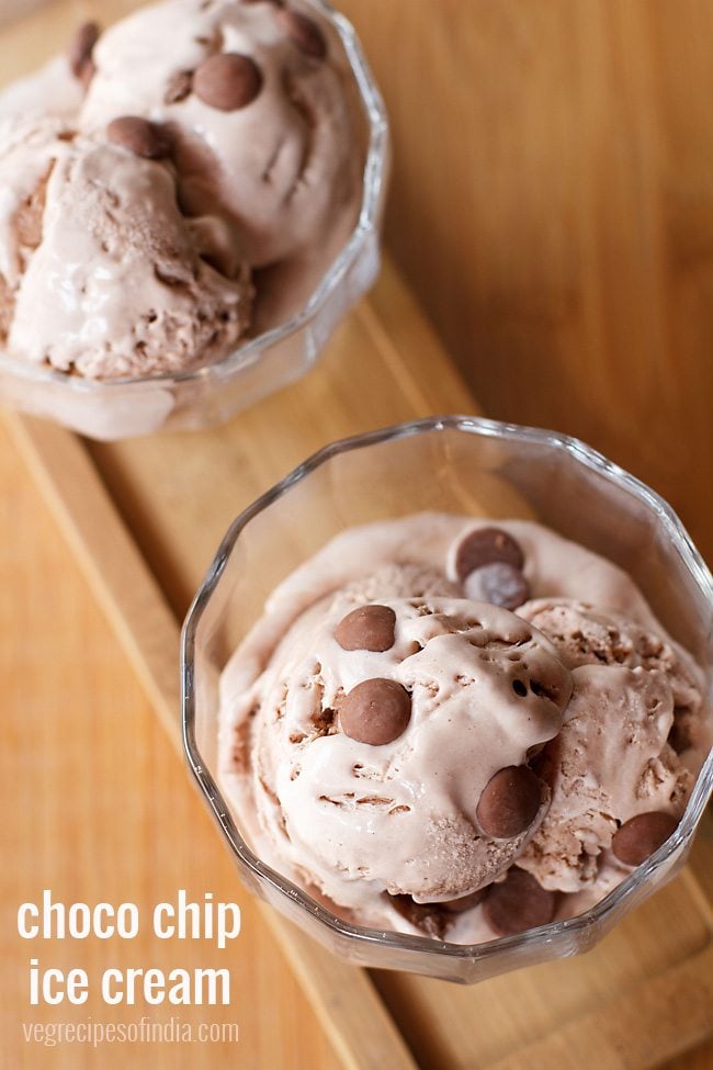 chocolate chip ice cream scoops topped with chocolate chips served in glass bowls