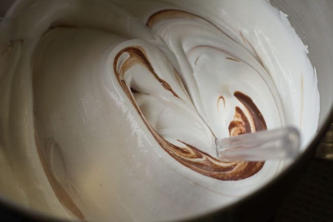 folding the chocolate mixture in the whipped cream