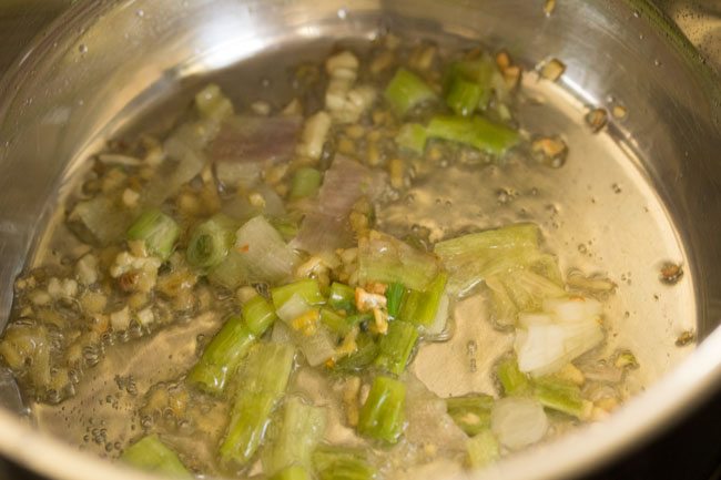 chopped spring onions in the pan