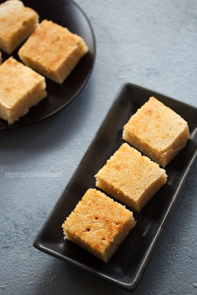 rava cake served in long black plate