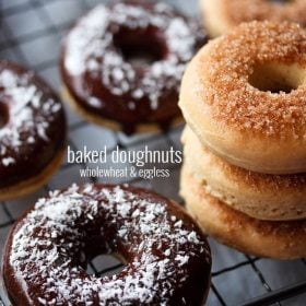 chocolate donut with more glazed donuts on wired rack