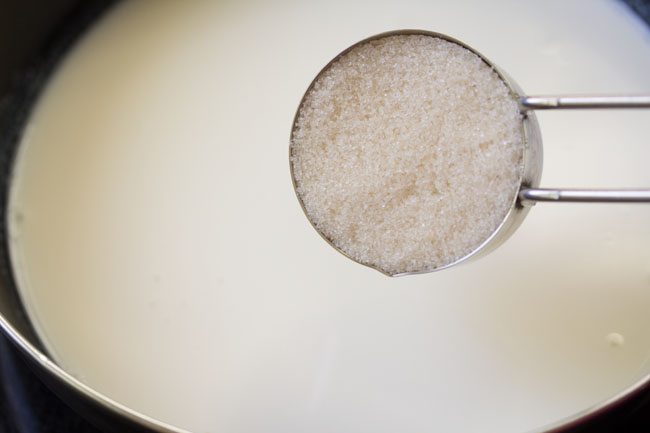 sugar being added to milk