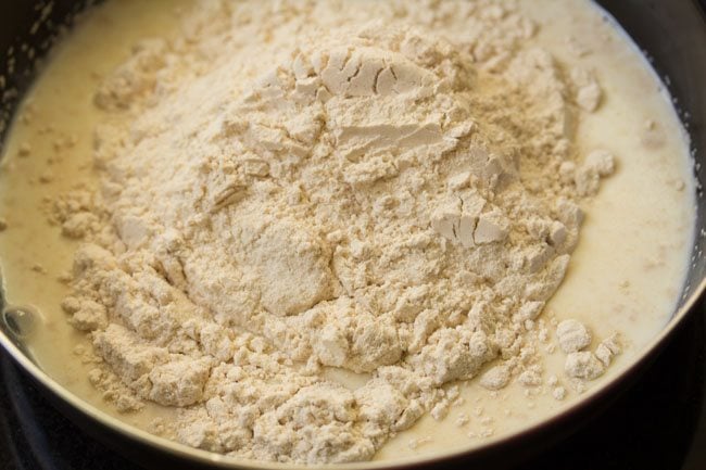 mound of wheat flour in milk