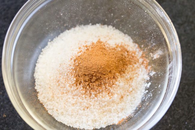 ground cinnamon and fine sugar in glass bowl