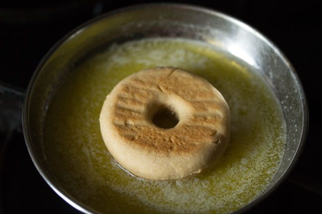 donut placed on melted butter
