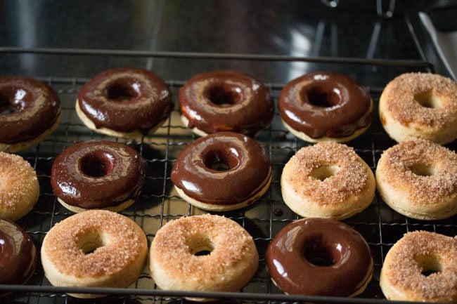 chocolate donuts with cinnamon donuts on wired tray