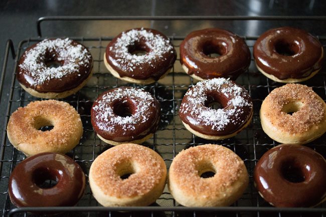 desiccated coconut sprinkled on chocolate donuts