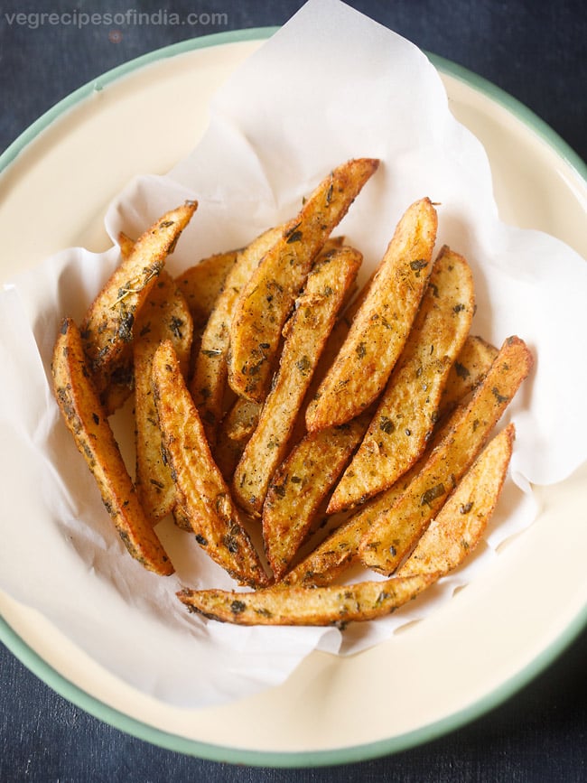 fried potato wedges served on a plate
