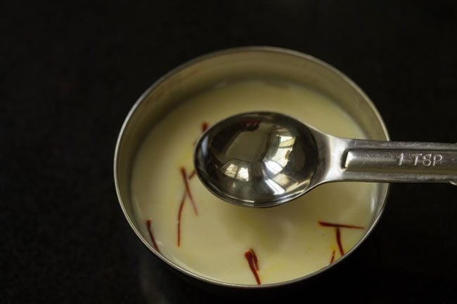 kewra water added to saffron milk mixture