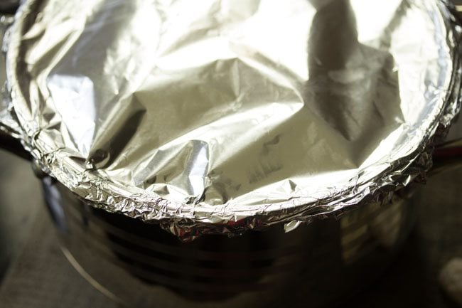 sealing the pan with an aluminum foil.