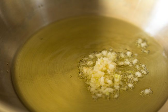 chopped garlic in oil in a pan