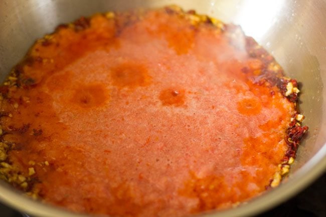 tomato puree in the pan