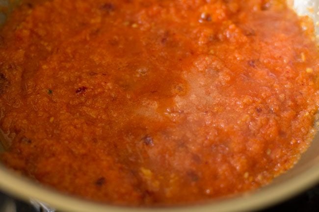 salt added to tomato puree in the pan