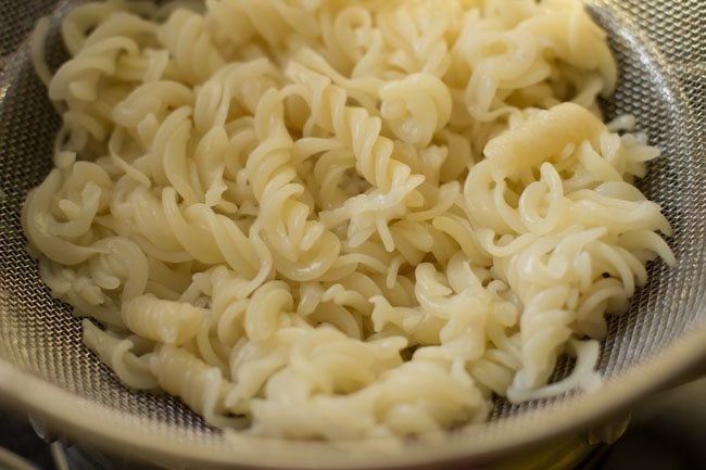 cooked pasta in a colander to make arrabiata pasta recipe