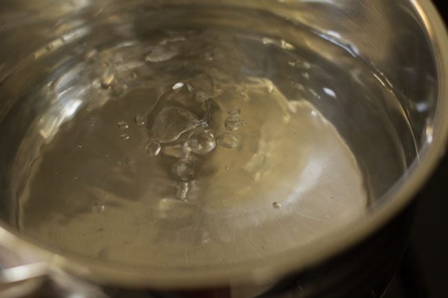 boiling water with salt for pasta in a steel pan