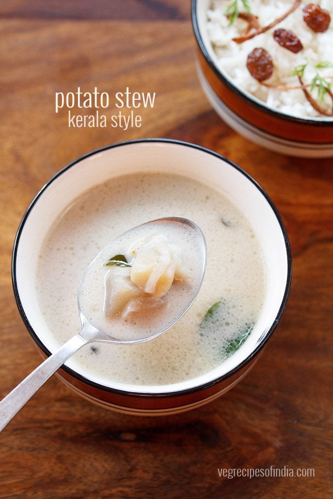 potato stew served in a blue rimmed ceramic bowl with some in a spoon and text layovers.