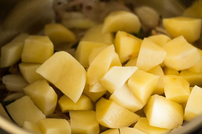 chopped potatoes added to the pan. 