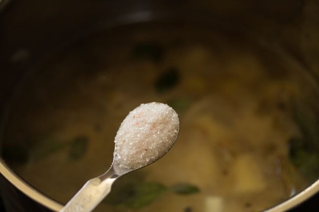 adding salt to the pan. 