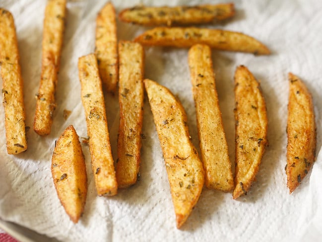 wedges absorbing excess oil on a paper towel