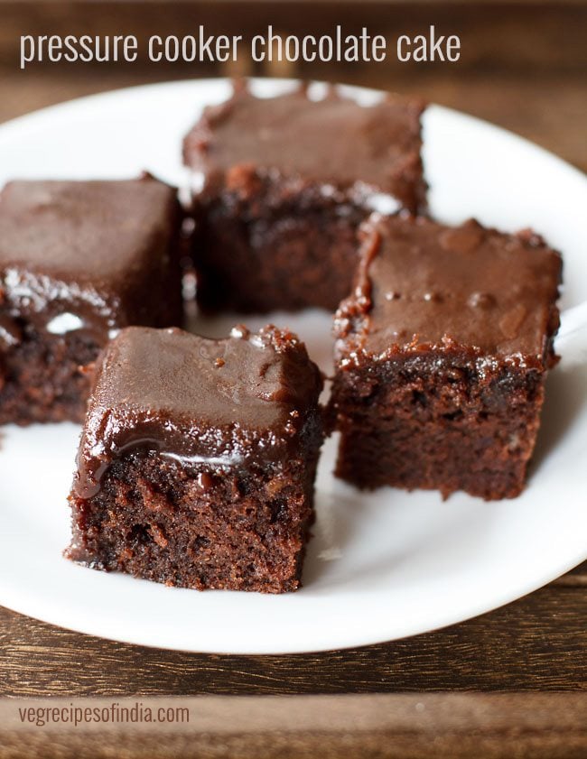 pieces of pressure cooker chocolate cake served on a white plate.