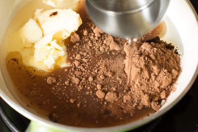 adding water to pan. 