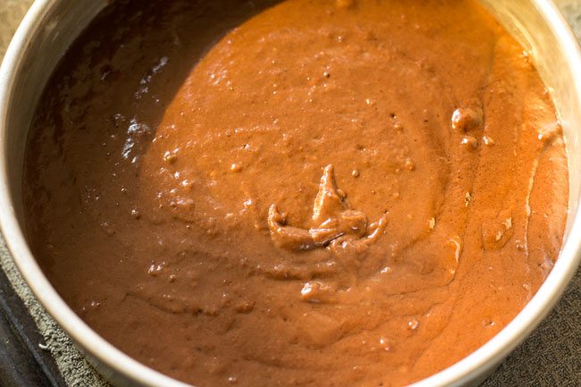 batter added in the greased baking tray. 