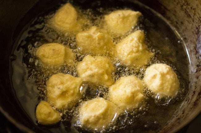 frying pakodas in hot oil. 