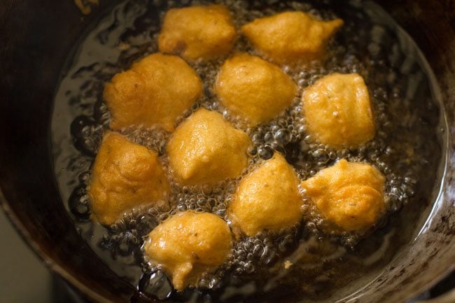 frying pakodas till golden and crisp. 