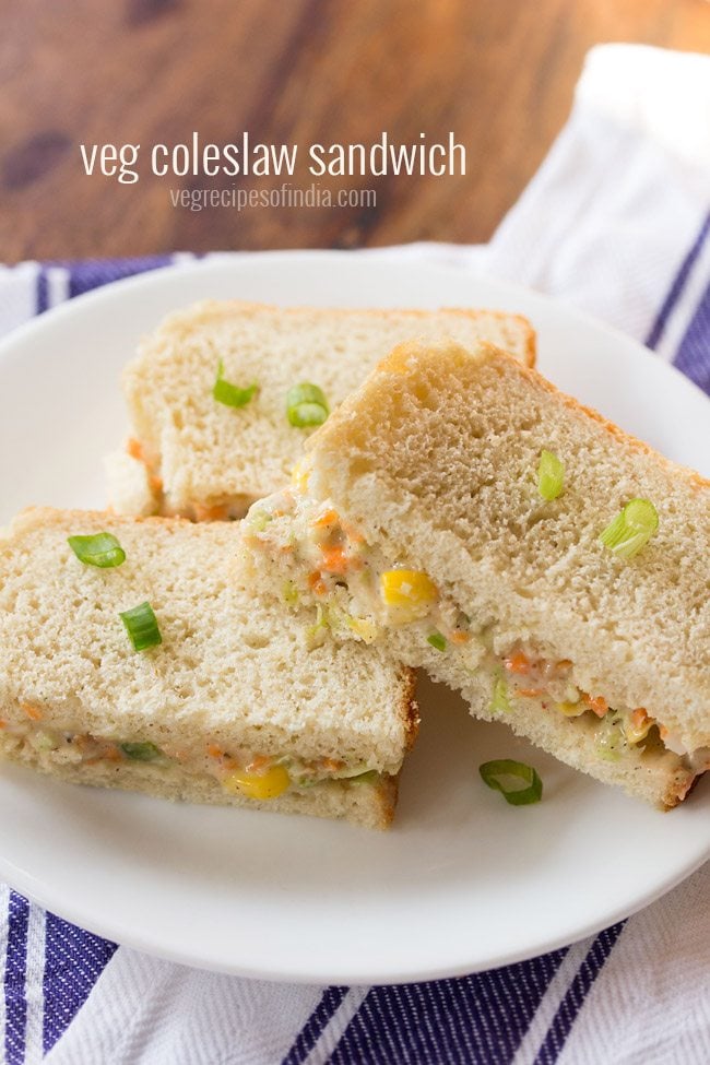 coleslaw sandwich served on a white plate.