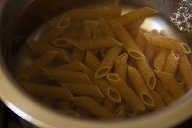 penne pasta added to the pan.