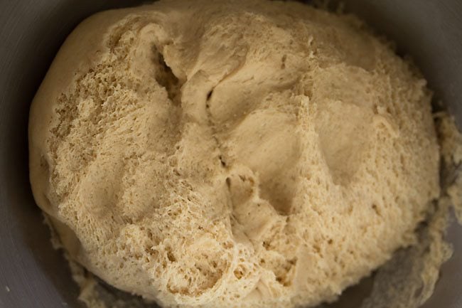 the underside of the whole wheat pizza dough recipe after rising is stringy and bubbly looking.