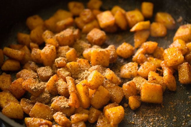 adding garam masala powder and dry mango powder