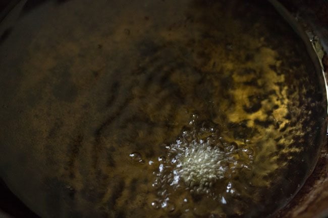 frying bread vada in hot oil