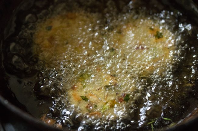 frying bread vada in hot oil