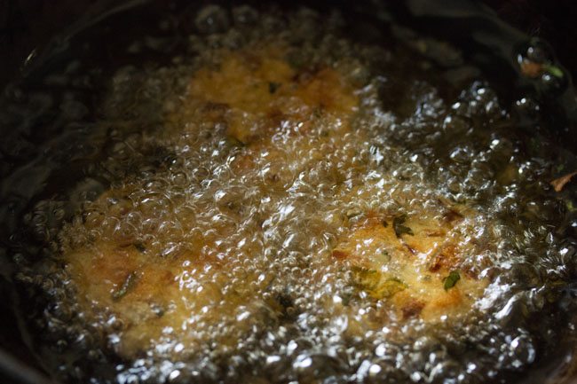 frying bread vada in hot oil
