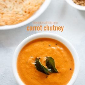 carrot chutney served in a bowl with dosa and text layover.