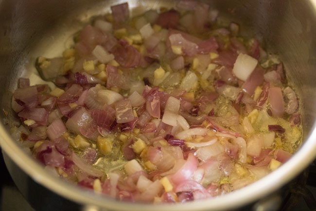 sautéing ginger with onions for making carrot ginger soup recipe.