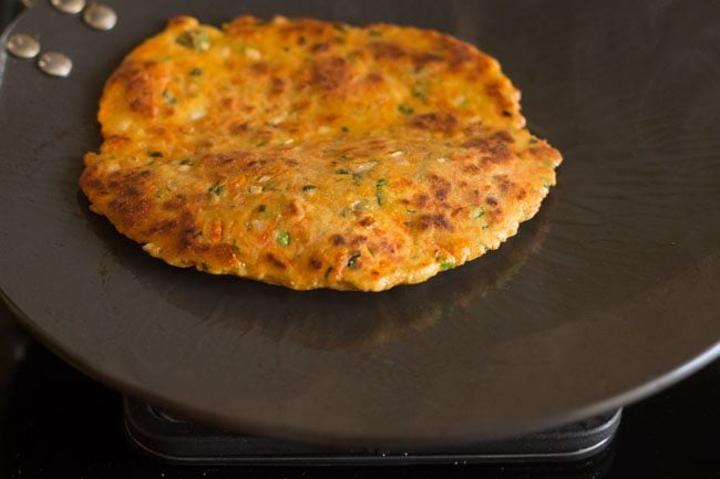 cooked carrot paratha on tawa