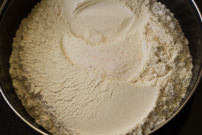 whole wheat flour and salt in a mixing bowl.