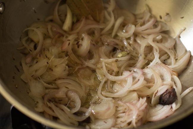 sautéing onions in hot ghee. 