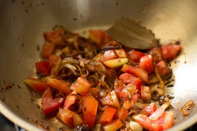 chopped tomatoes added to the pan. 