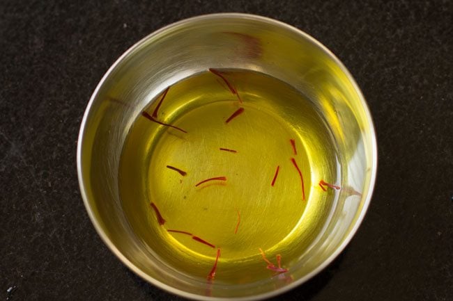 soaking saffron in warm water. 