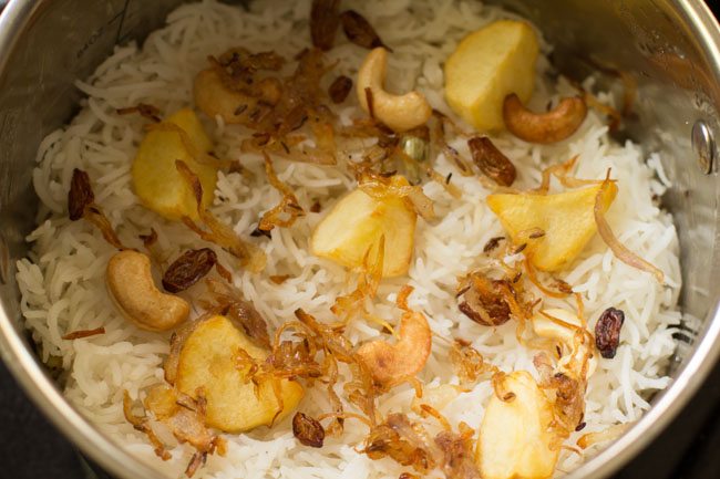 fried onions added to the cooked rice layer. 