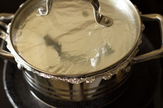 pan covered with lid and placed on a preheated tawa. 