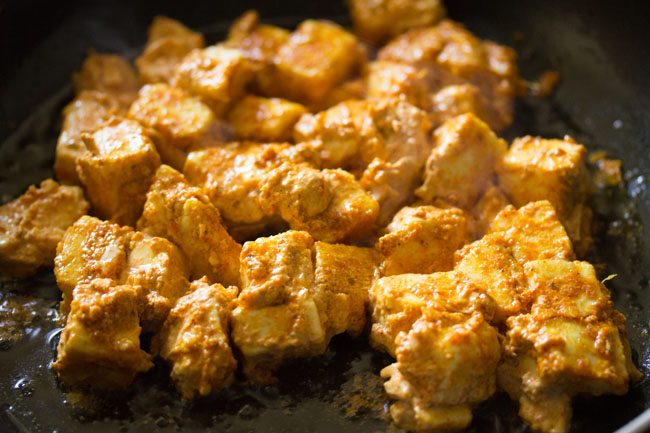 cooking paneer cubes for making paneer tikka wrap recipe.